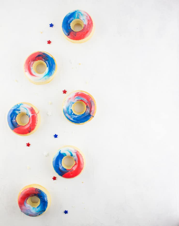 Give your 4th of July morning (or your afternoon BBQ) an extra bit of color with these red, white, and blue 4th of July doughnuts! | The Simple, Sweet Life