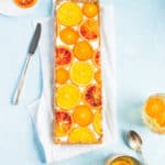 This mimosa tart is everything you love about brunch and then some! With it's bright candied oranges, boozy champagne filling and to-die-for graham cracker crust, what's not to love?