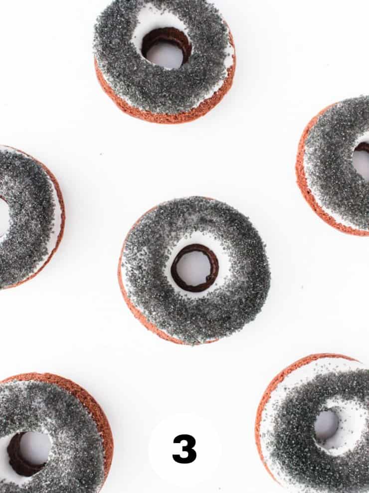 Overhead view of iced and sugared chocolate doughnuts.