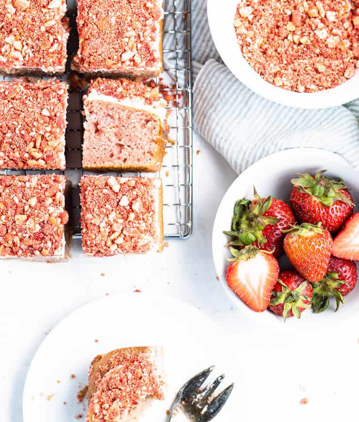 overhead view of strawberry cake slices on a cooling rack